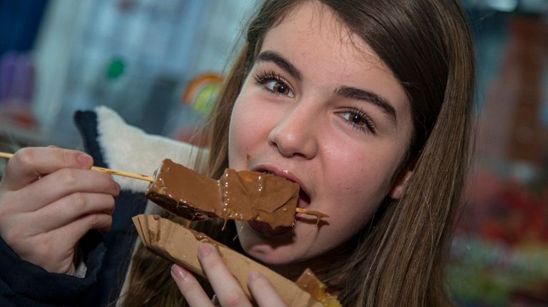 Francesca Derasmo, 12, of Massapequa, enjoys some chocolate