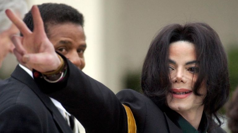 Pop icon Michael Jackson waves to his supporters