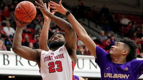 Stony Brook guard Andrew Garcia gets fouled on