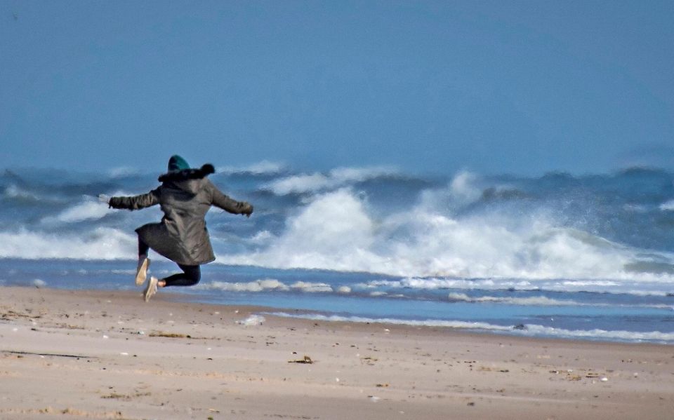 A woman kicking her heels while enjoying the