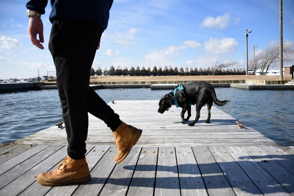 Rob Balkam, 25, of Lindenhurst, walks with his