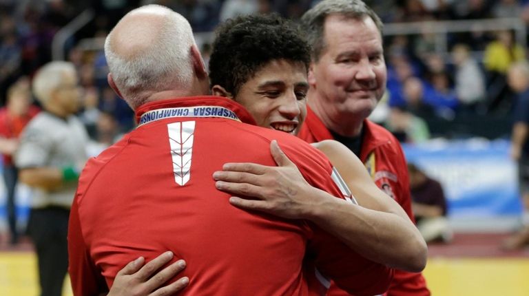 Jordan Titus of Center Moriches reacts after defeating