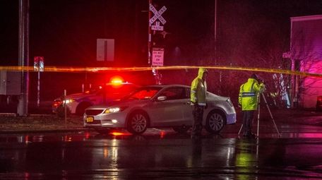 Police at the East Patchogue crash scene on