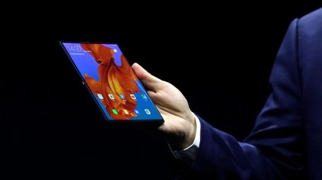 Huawei CEO Richard Yu displays the new Huawei