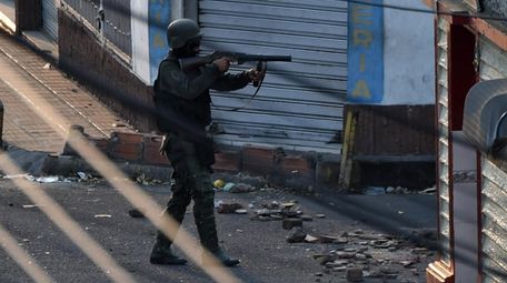 A member of the Venezuelan National Guard points