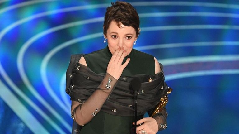 Olivia Colman accepts the award for best performance