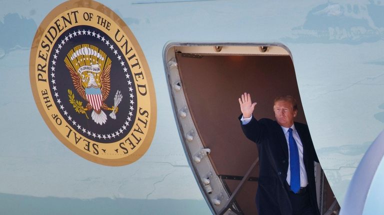 President Donald Trump waves Monday as he boards