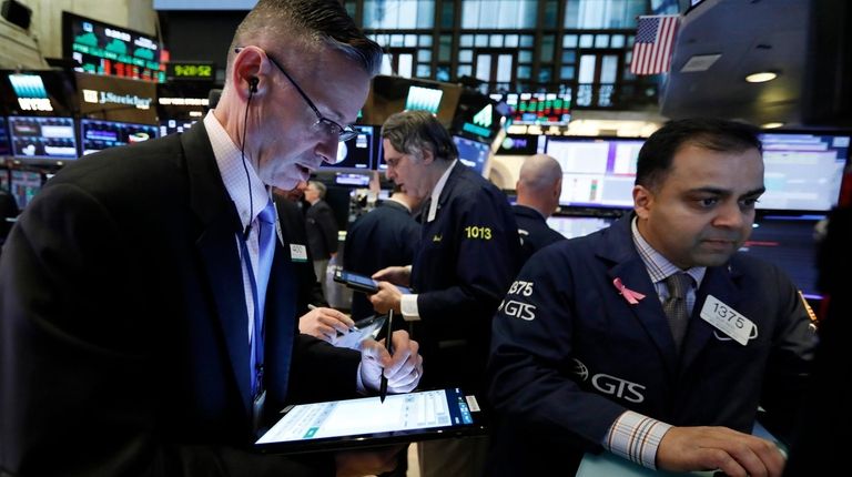 Trader Neil Catania, left, and specialist Dilip Patel