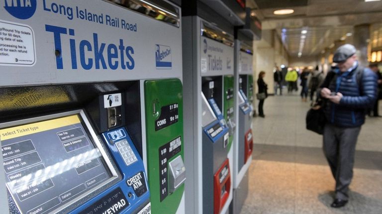 Long Island Rail Road passengers purchase tickets at