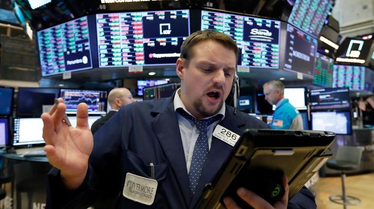 Trader Michael Milano works on the floor of