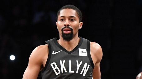 Nets guard Spencer Dinwiddie dribbles the ball up