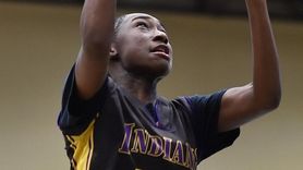 Ashley Cattle #21 of Sewanhaka hits running layup