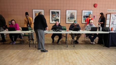 Attendees at a job fair in Brentwood apply