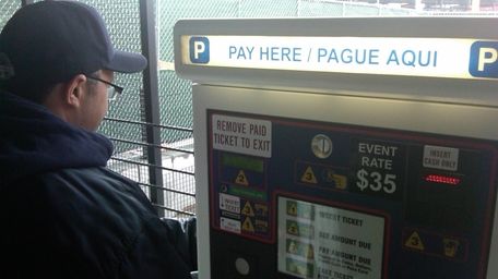 A pay machine inside a parking lot at
