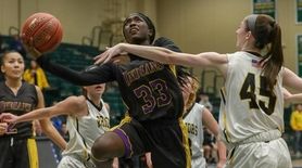 Carly Bolivar #33 of Sewanhaka goes up for