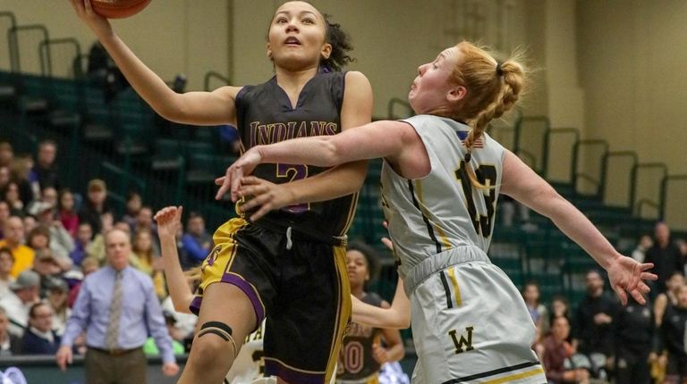 Nia Lariosa #2 of Sewanhaka goes up for