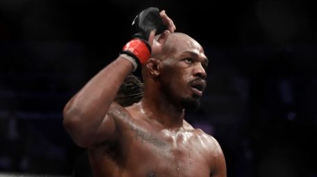 Jon Jones celebrates after defeating Anthony Smith following