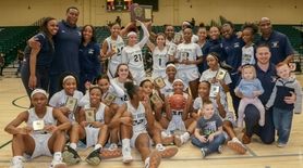 Baldwin players and coaches celebrate with the winning