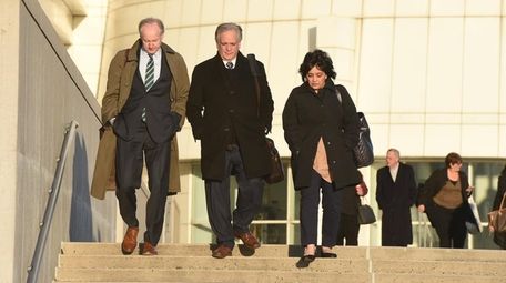 Edward and Linda Mangano leave federal court in