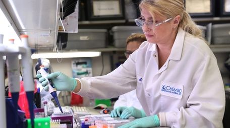 A Chembio Diagnostics scientist in Medford analyzes protoypes