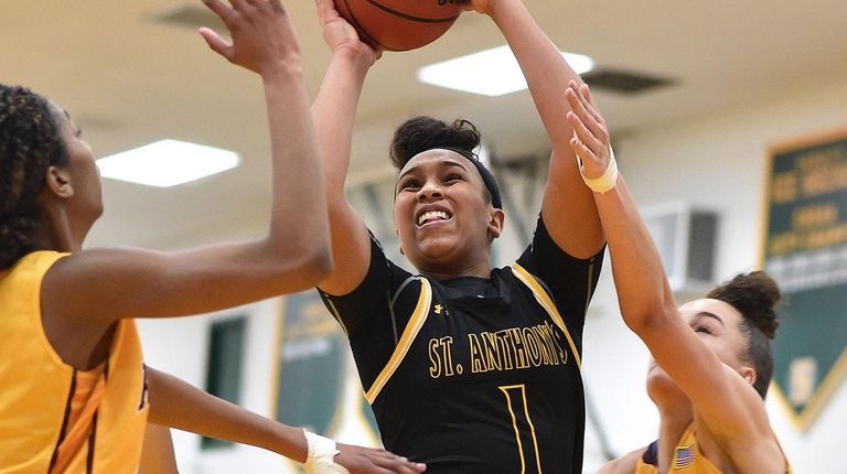 Sydney Taylor of St. Anthony's shoots a contested