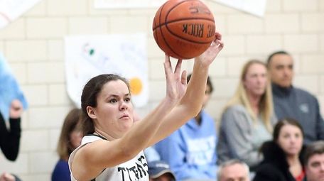 Holy Trinity's Natalie Stark shoots a three-pointer during