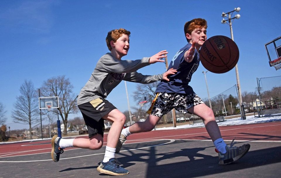 Eleven-year-old twins Liam, left, and Tommy McCarvill of