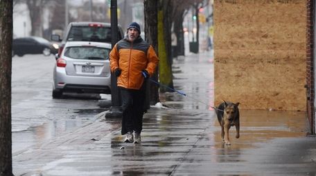 Frank Porfido, of Patchogue, runs with his dog