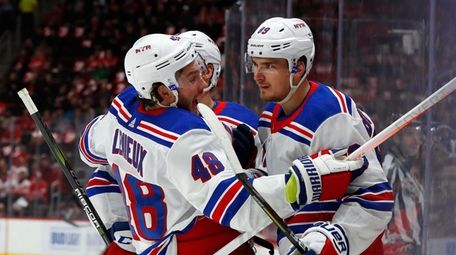 Rangers right wing Pavel Buchnevich, right, celebrates his