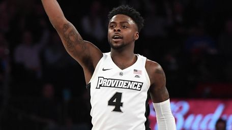 Providence guard Maliek White reacts after he sinks