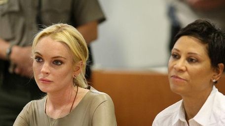 Lindsay Lohan in court with her lawyer Shawn