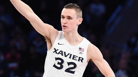 Xavier forward Ryan Welage reacts after he scores