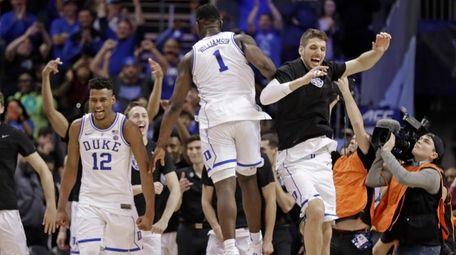 Duke players including Javin DeLaurier (12) and Zion