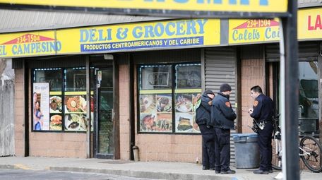 Police investigate the shooting at El Campesino Deli