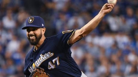 Gio Gonzalez throws during the first inning of