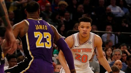 Kevin Knox #20 of the Knicks works against