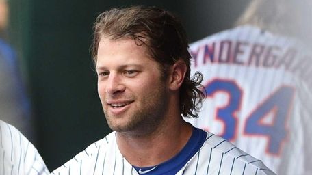 Kirk Nieuwenhuis looks on from the dugout after