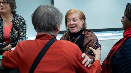 Holly Shaw, center, an associate professor at Adelphi
