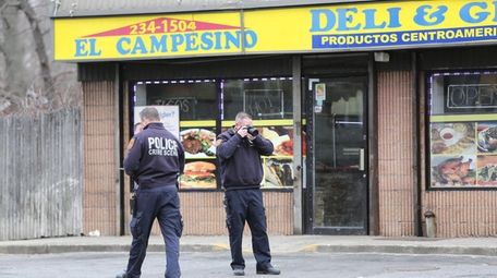 Suffolk County police investigate a shooting at 133