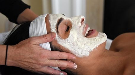 Erica Chan gets a facial from aesthetician Amber