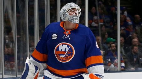 Robin Lehner of theIslanders looks on after surrendering