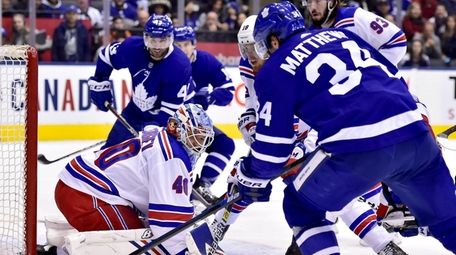 Toronto Maple Leafs center Auston Matthews (34) and