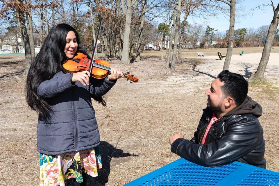 (L-R) Jairy Ambrocio, 12, of Bay Shore, plays