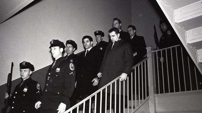 John (Sonny) Franzese is escorted down a staircase