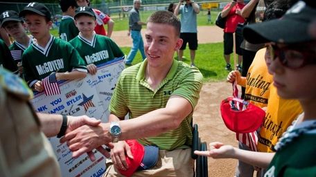 Lt. James Byler shakes hands with members of