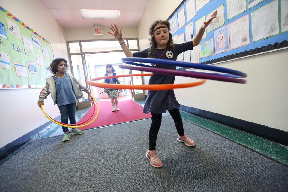 Second grader, Sarah Reddington shows off her hula