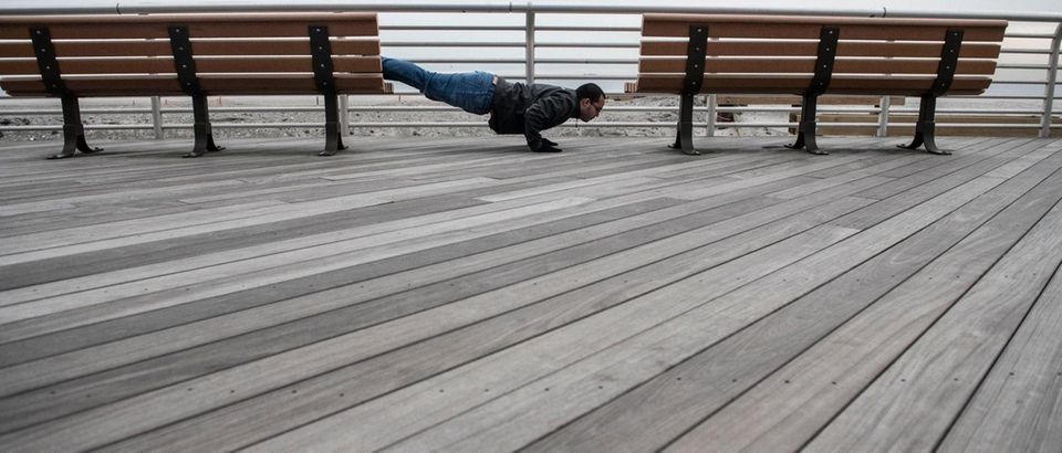 Daniel Sanin works on his decline push-ups on