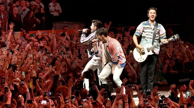 Nick Jonas, left, Joe Jonas and Kevin Jonas