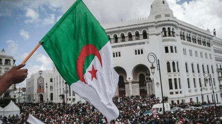 People chant slogans during a demonstration in Algiers,