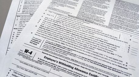 This photo shows an IRS W-4 form on